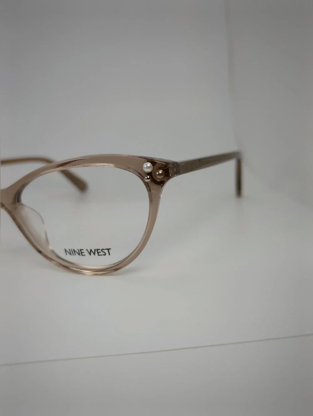 Nine West NW5152 Taupe Cat-Eye Eyeglass Frames with Pearl Accent.